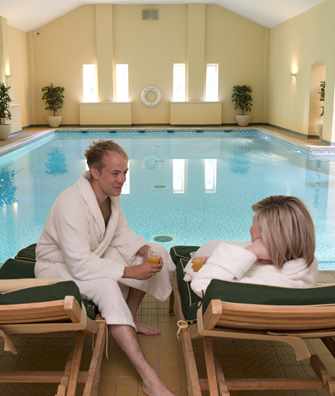 Couple relaxing by pool at Bodysgallen Spa