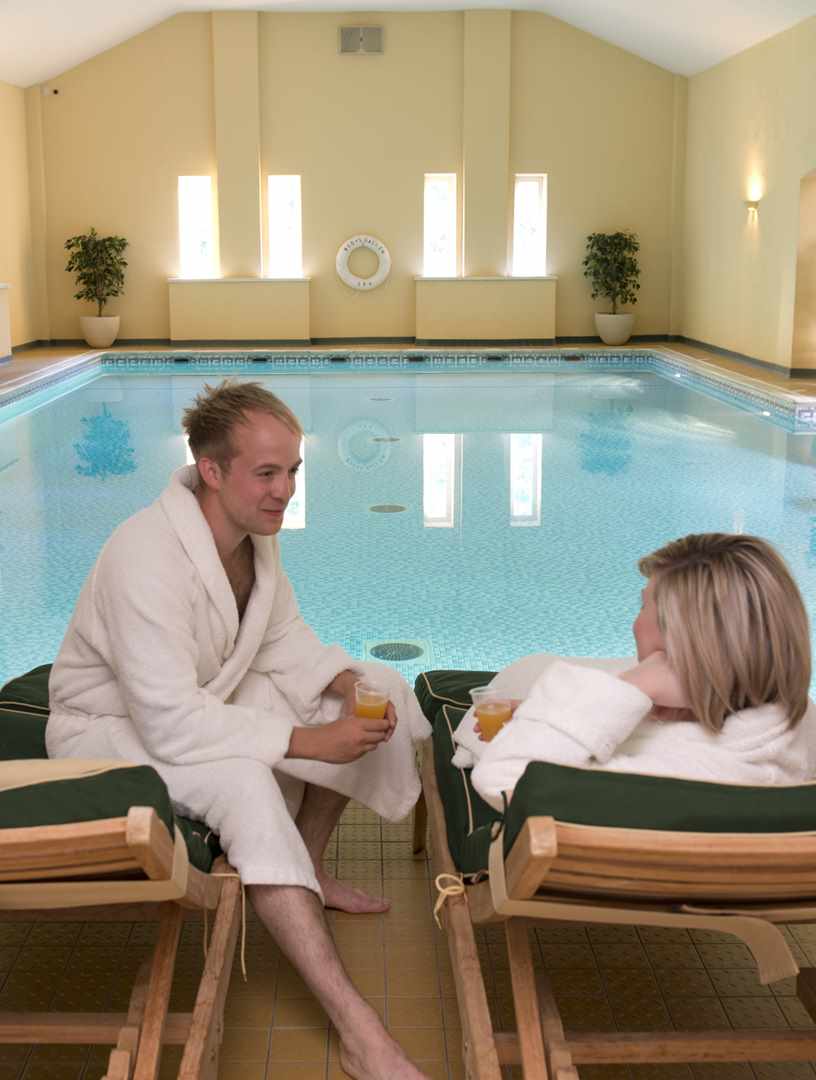 Couple relaxing by pool at Bodysgallen Spa Couple relaxing by pool at Bodysgallen Spa