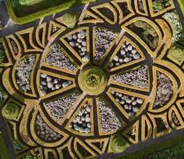 Aerial view of 17th century parterre at Bodysgallen Hall in autumn