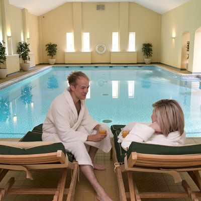 Couple relaxing by pool at Bodysgallen Spa Couple relaxing by pool at Bodysgallen Spa