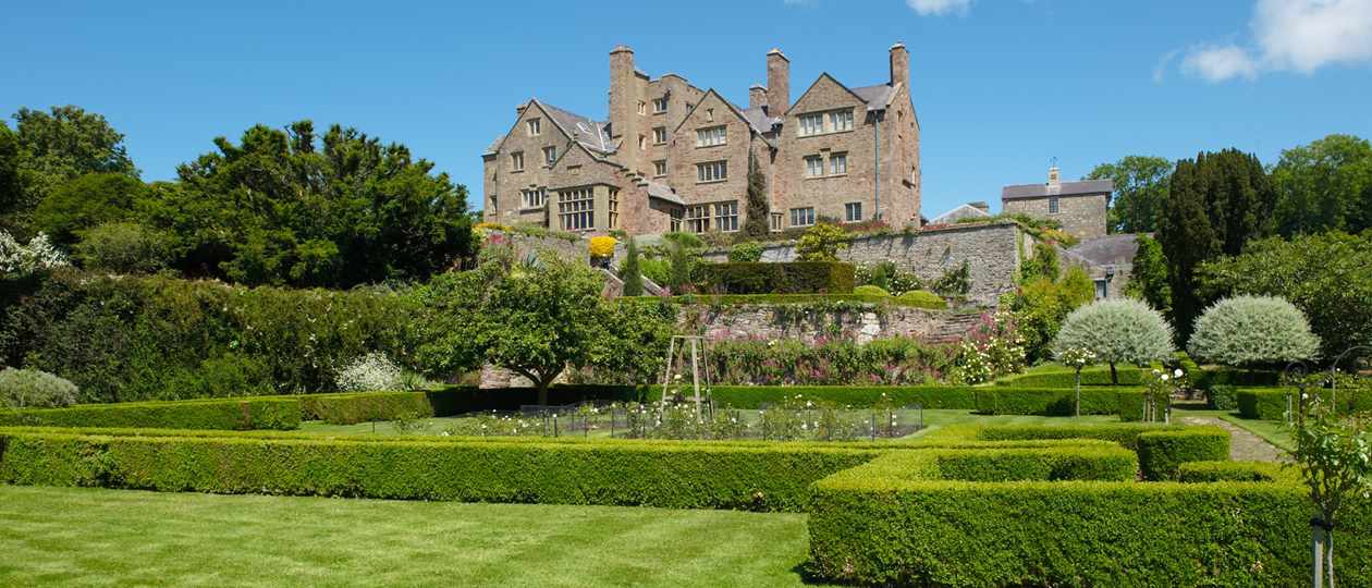 Bodysgallen Hall across lawns in summer