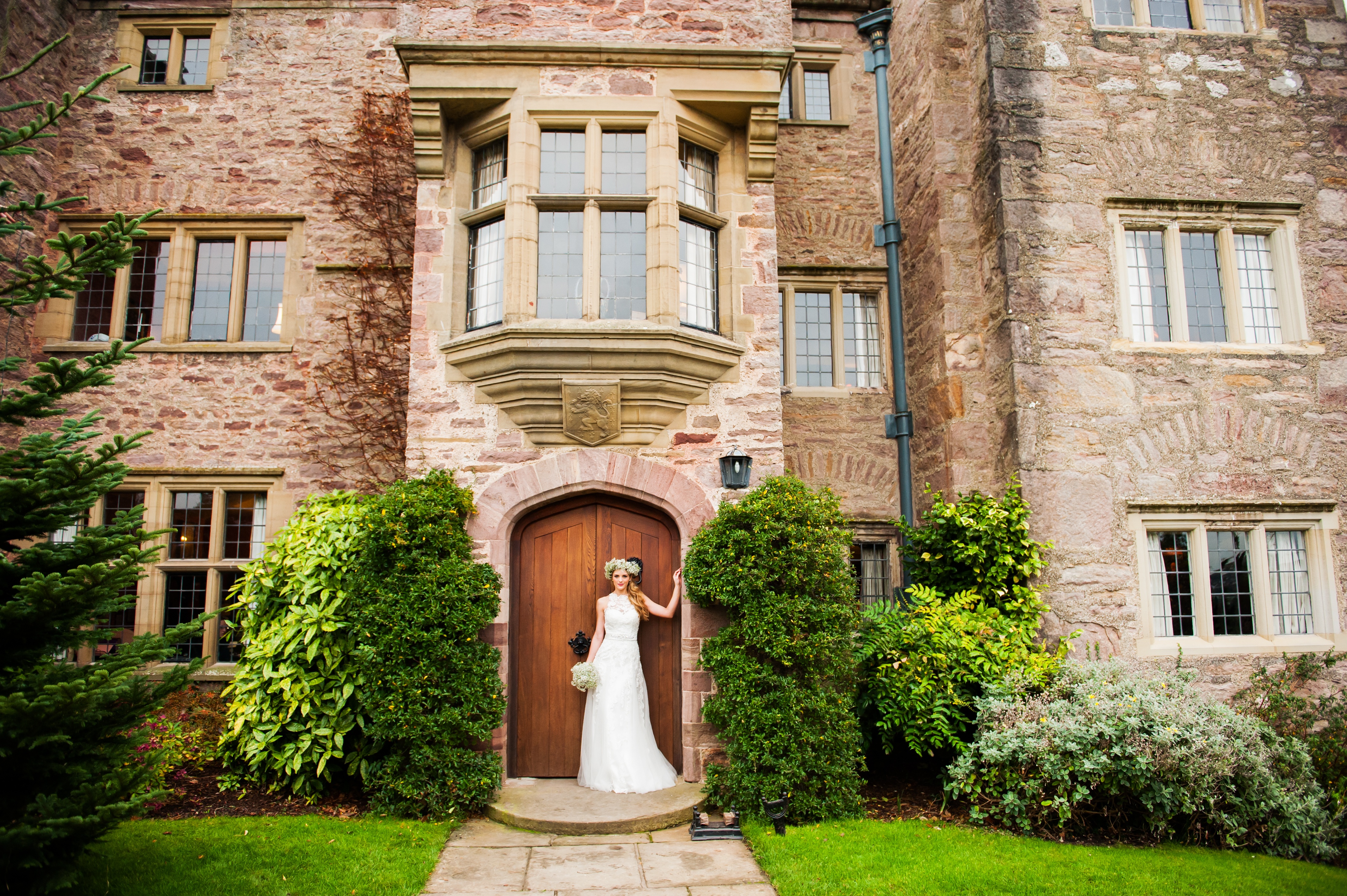 Bride outside entrance to Bodysgallen Hall