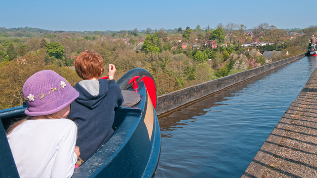 Narrow boat crosses the Pontcysyllte Aquaduct in North Wales