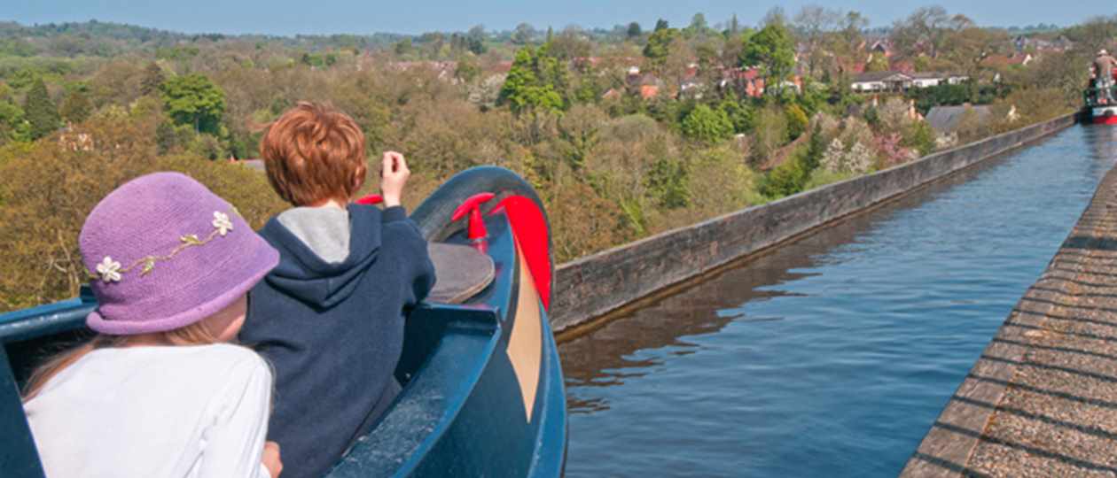 Narrow boat crosses the Pontcysyllte Aquaduct in North Wales