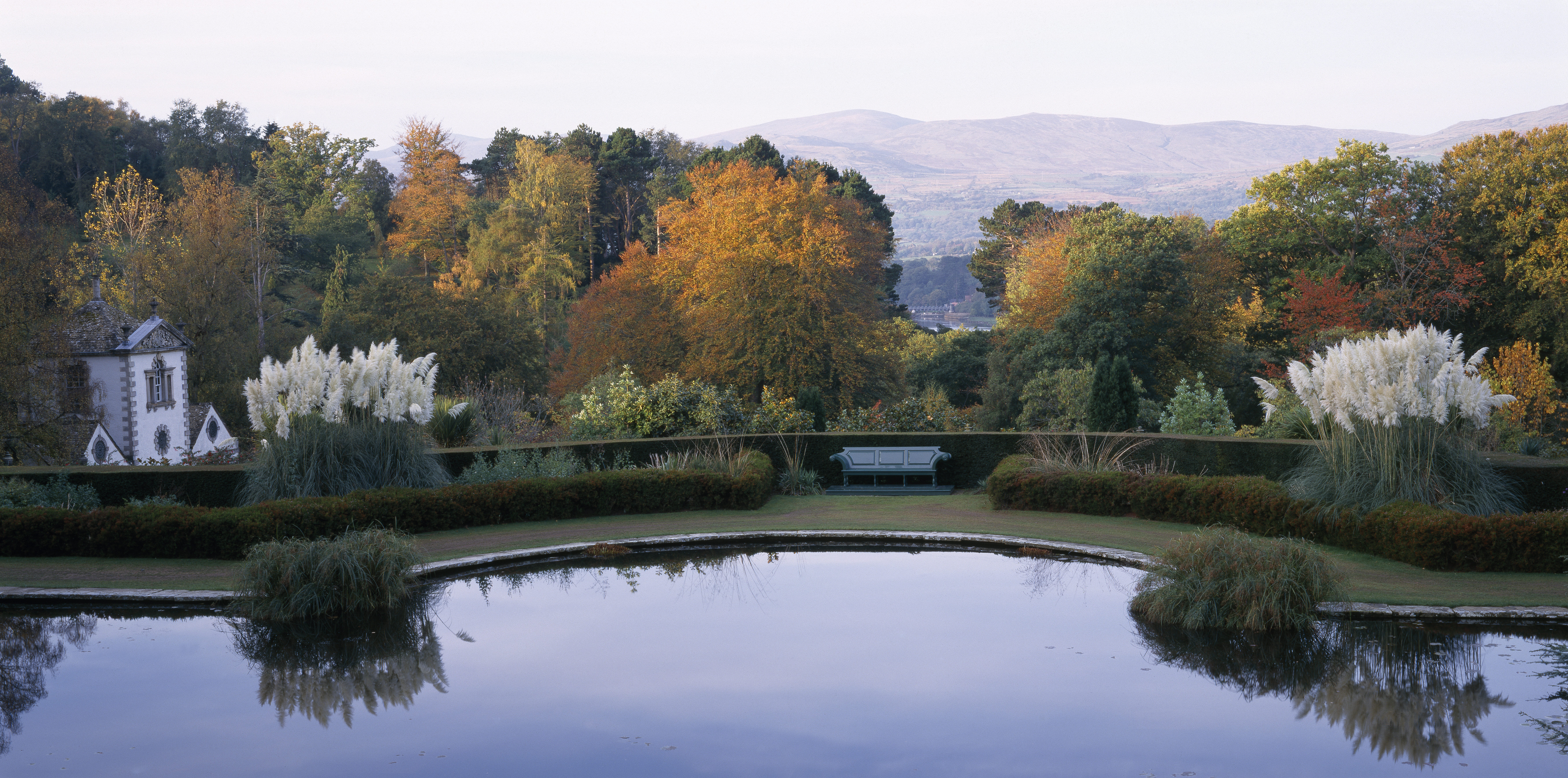 View across lake at National Trust Bodnant Gardens in North Wales