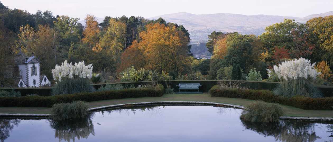 View across lake at National Trust Bodnant Gardens in North Wales