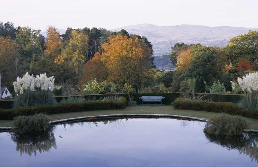 View across lake at National Trust Bodnant Gardens in North Wales