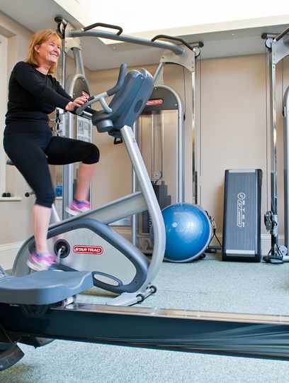 Guest exercising in the Gym at Bodysgallen Spa Guest exercising in the Gym at Bodysgallen Spa