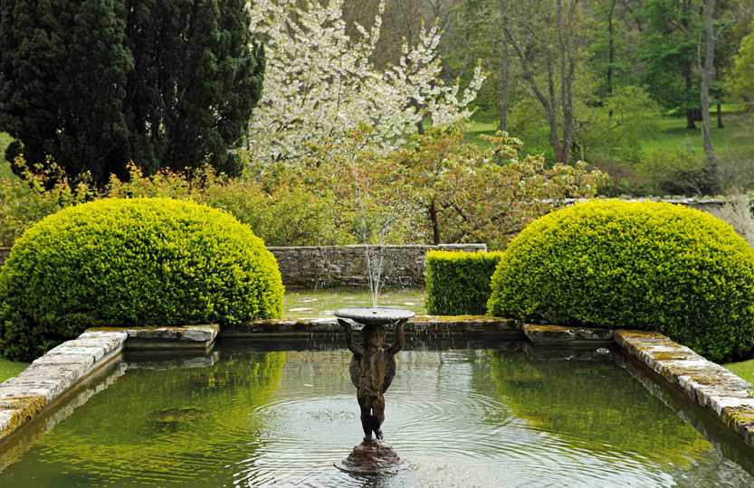 Spring blossom and lily pond at Bodysgallen Hall