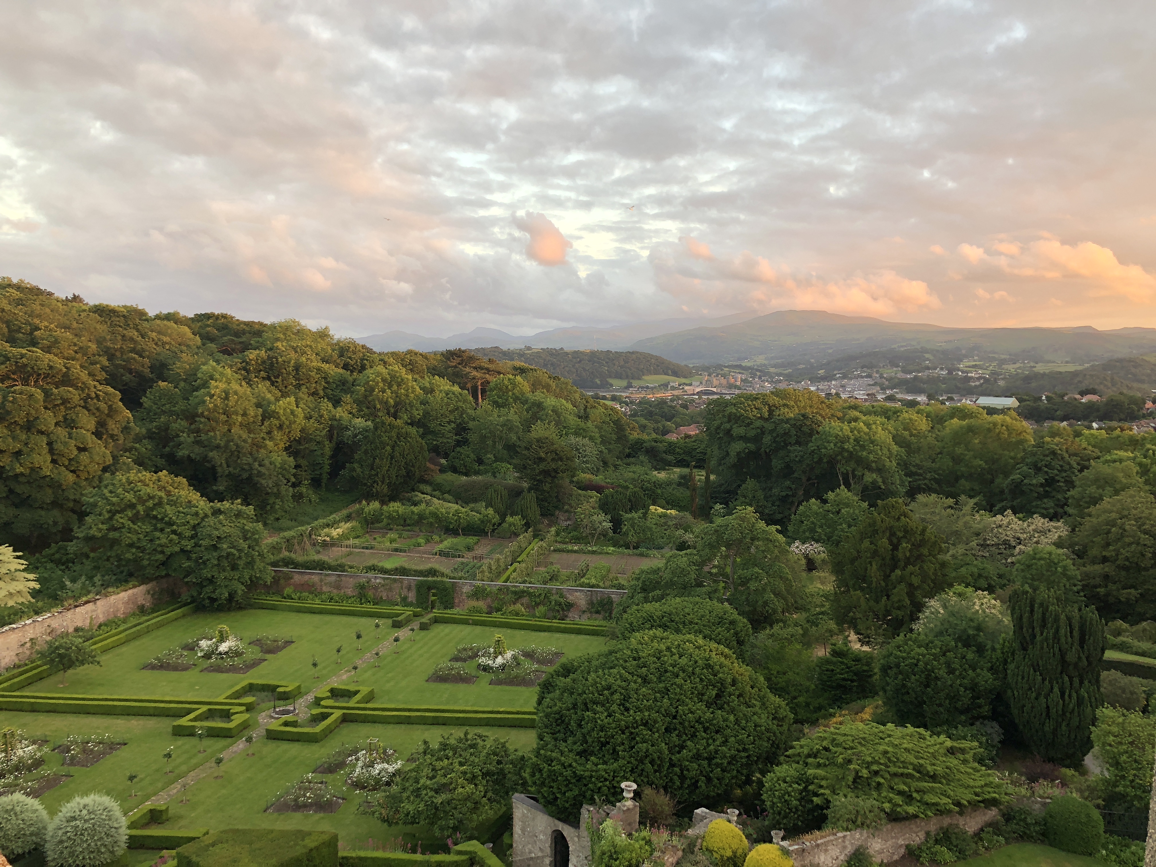 View across gardens at Bodysgallen Hall at sunset